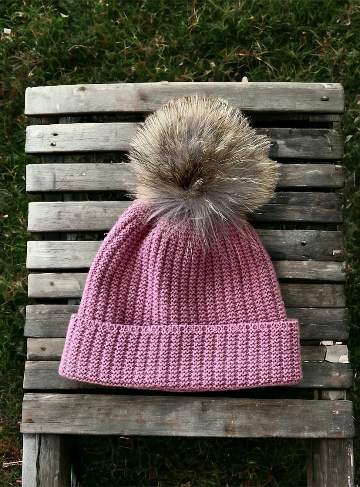 English knit hat with natural fur pompom.