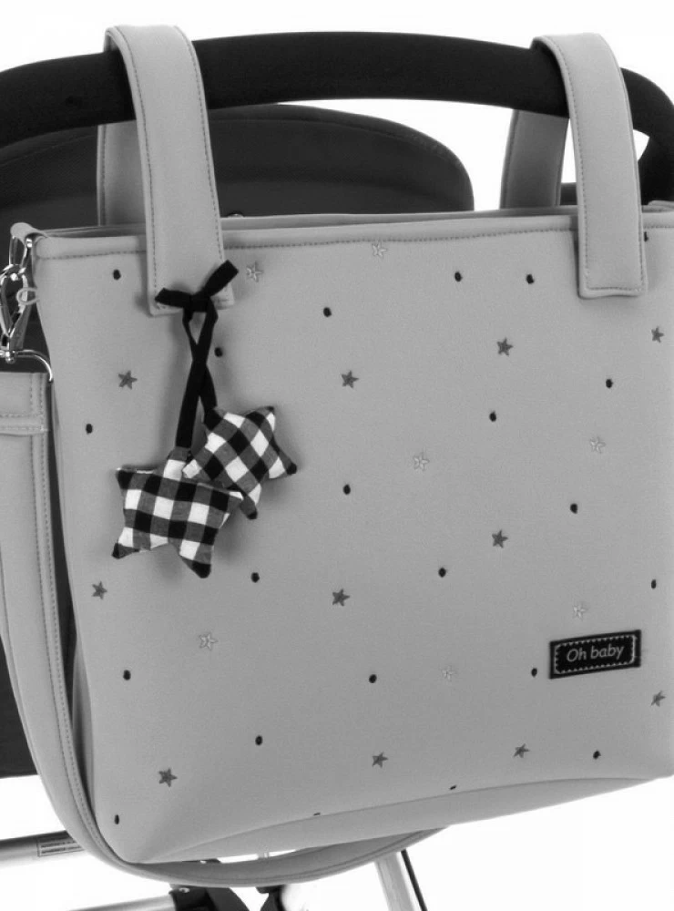 Gray faux leather satchel bag with black embroidered stars. Nuria Model